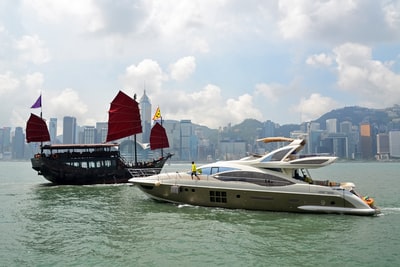 Daytime wharf near the white and green boat on the water
